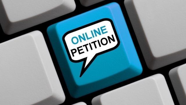 Blue Computer Keyboard with speech bubble showing Online Petition