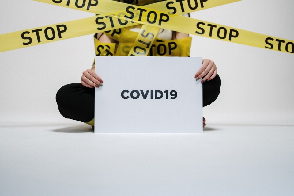 person-holding-covid-sign-3951600-1024x682