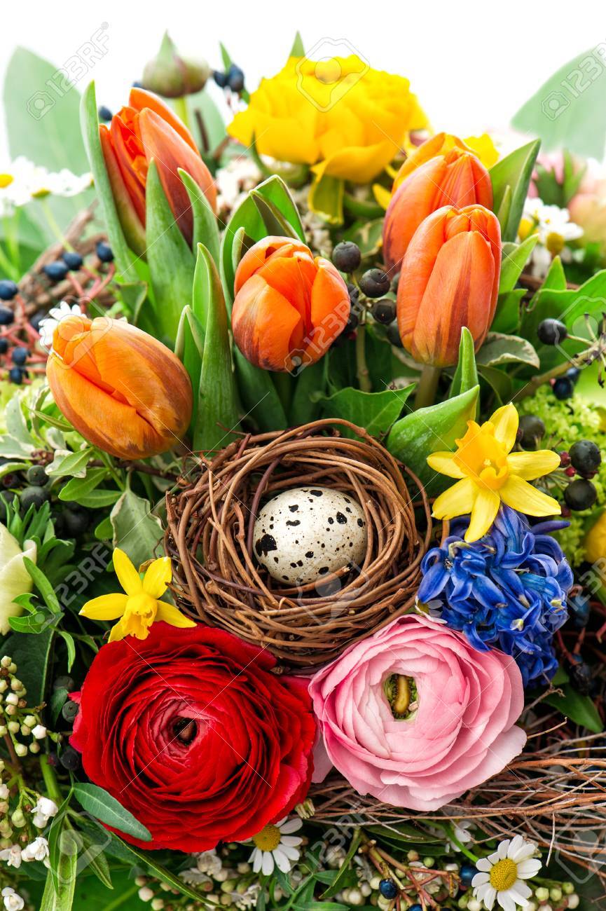 easter bouquet with egg decoration. spring flowers tulip, ranunc